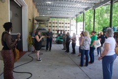 Our group gathers at the entrances to where the wine/grapes are delivered from other vineyards for processing