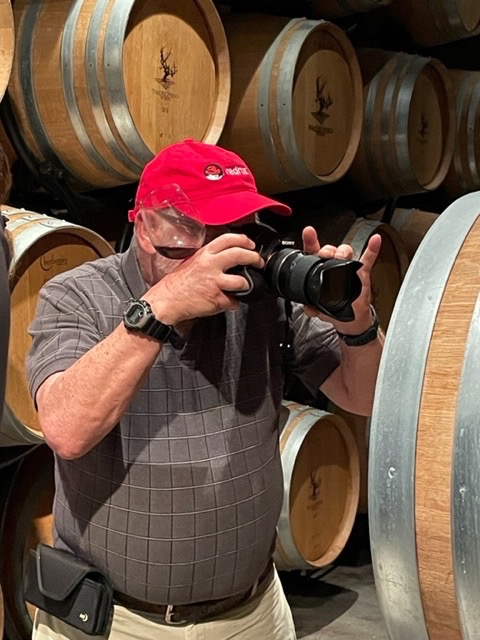 Jeff Parnes taking pictures of wine caskets