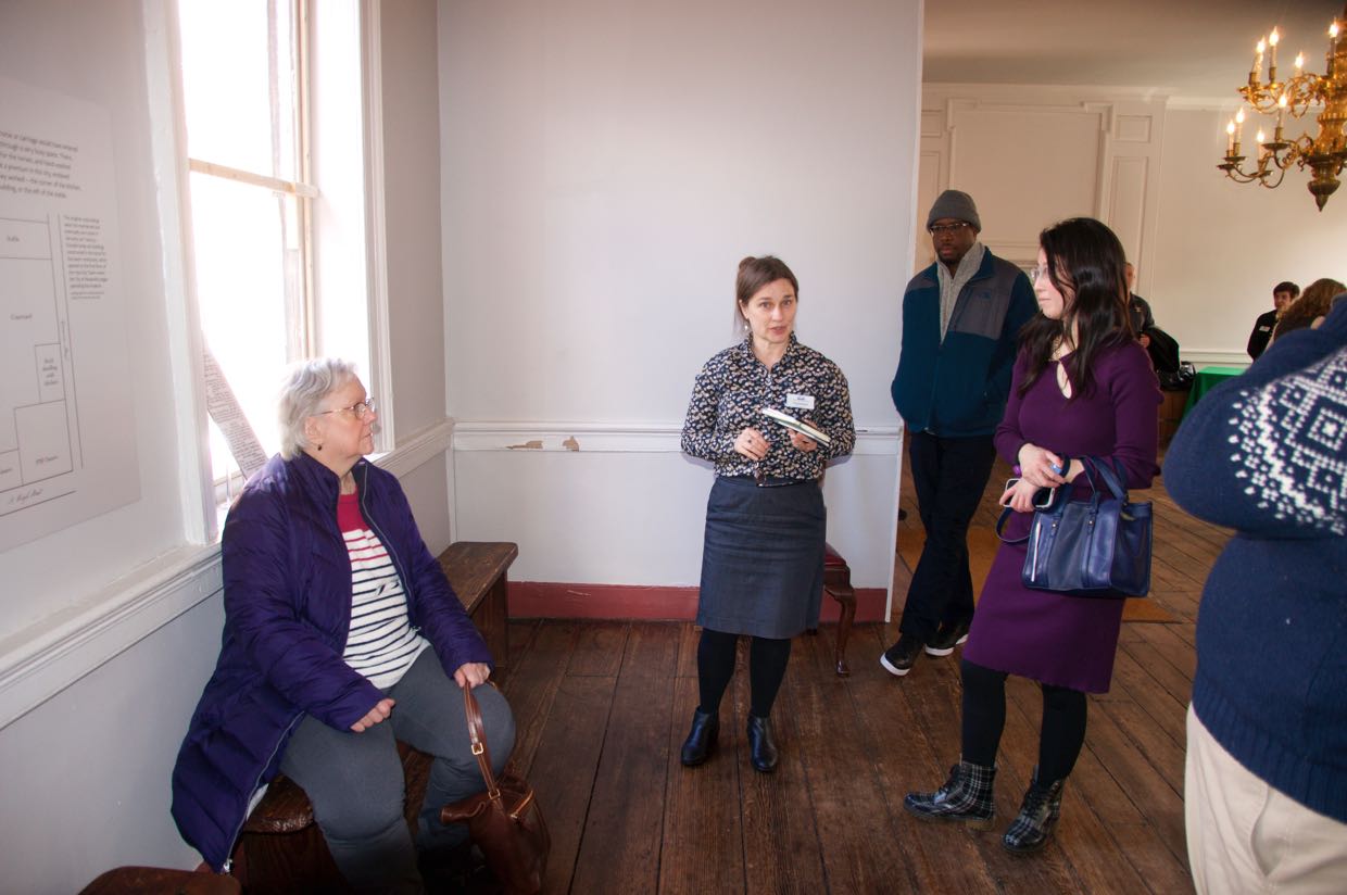 Our tour guide explaing the out buildings that wouyld hacen been visible from the window
