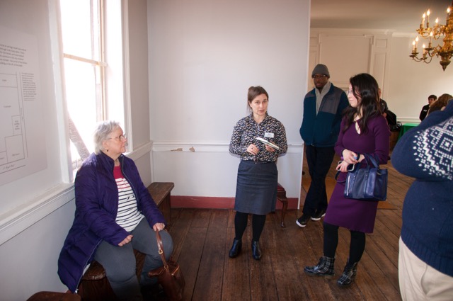 Our tour guide explaing the out buildings that wouyld hacen been visible from the window