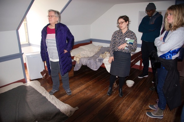Our tour guide explaining the sleeping arrangements