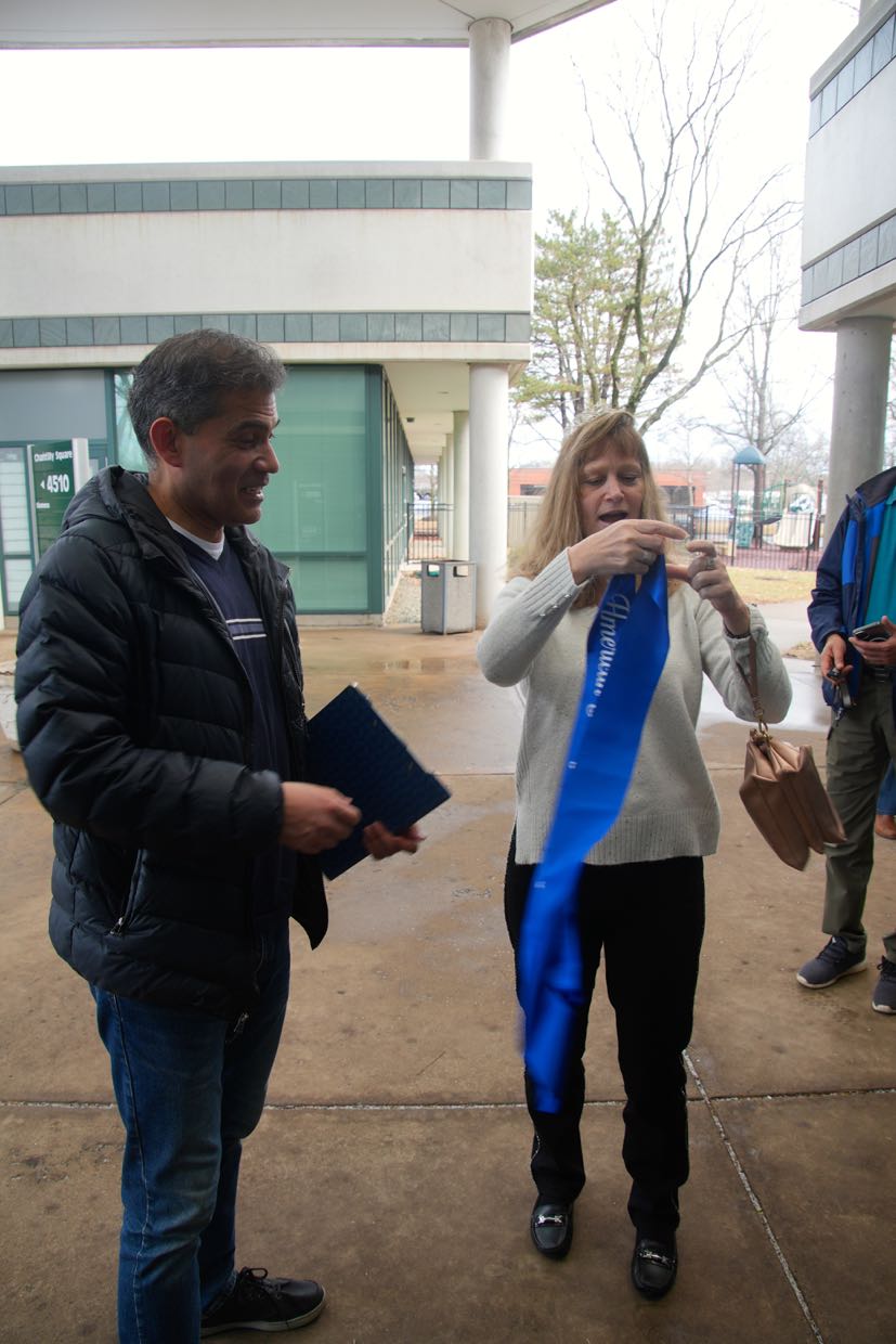 Our retiring Ranger Outing lead, Carolyn Miller, gets ready to pass her sash