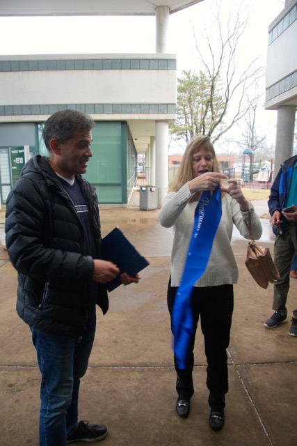 Our retiring Ranger Outing lead, Carolyn Miller, gets ready to pass her sash