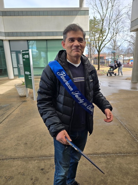 Our new ranger outing coordinater with the acrtumewnts of the office, sash and clipboard 