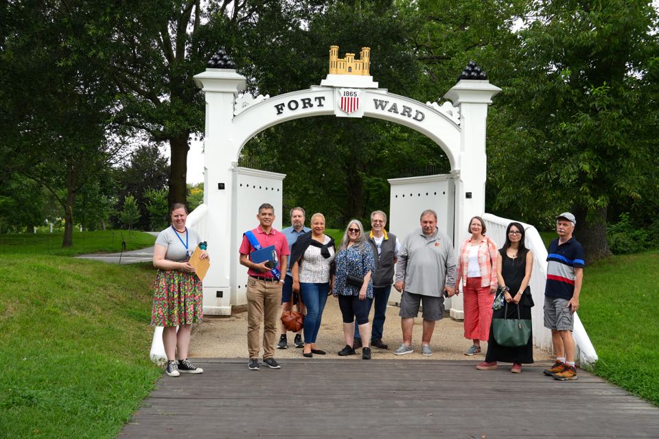 50) In front of one of the reconstructed gates (from the left, our guide, Julie, Edwin Videla, Eric Jensen, Lolita Harris, Cyndi and John Reichardt, Michael Beckner, Renee Milnes, Guoling Chen, and Vladimir Nesterovich)