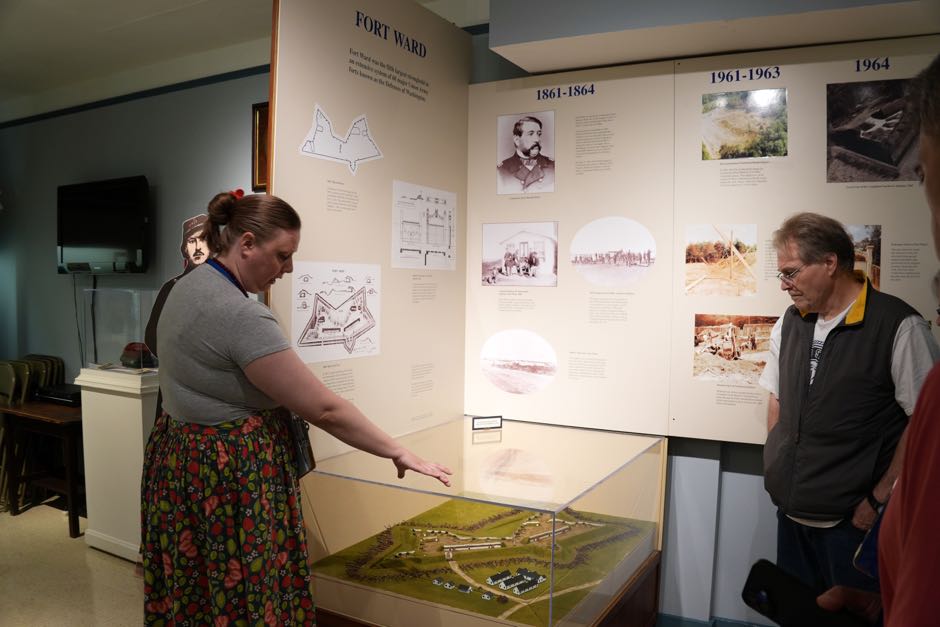 Pointing out the original and enlarged fort configurations
