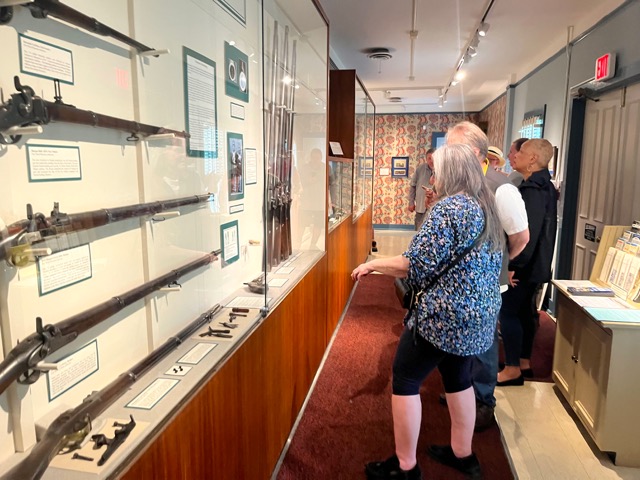 42) Examing the exhibit cabinets (Cyndi and John Reichardt, and Lolita Harris)